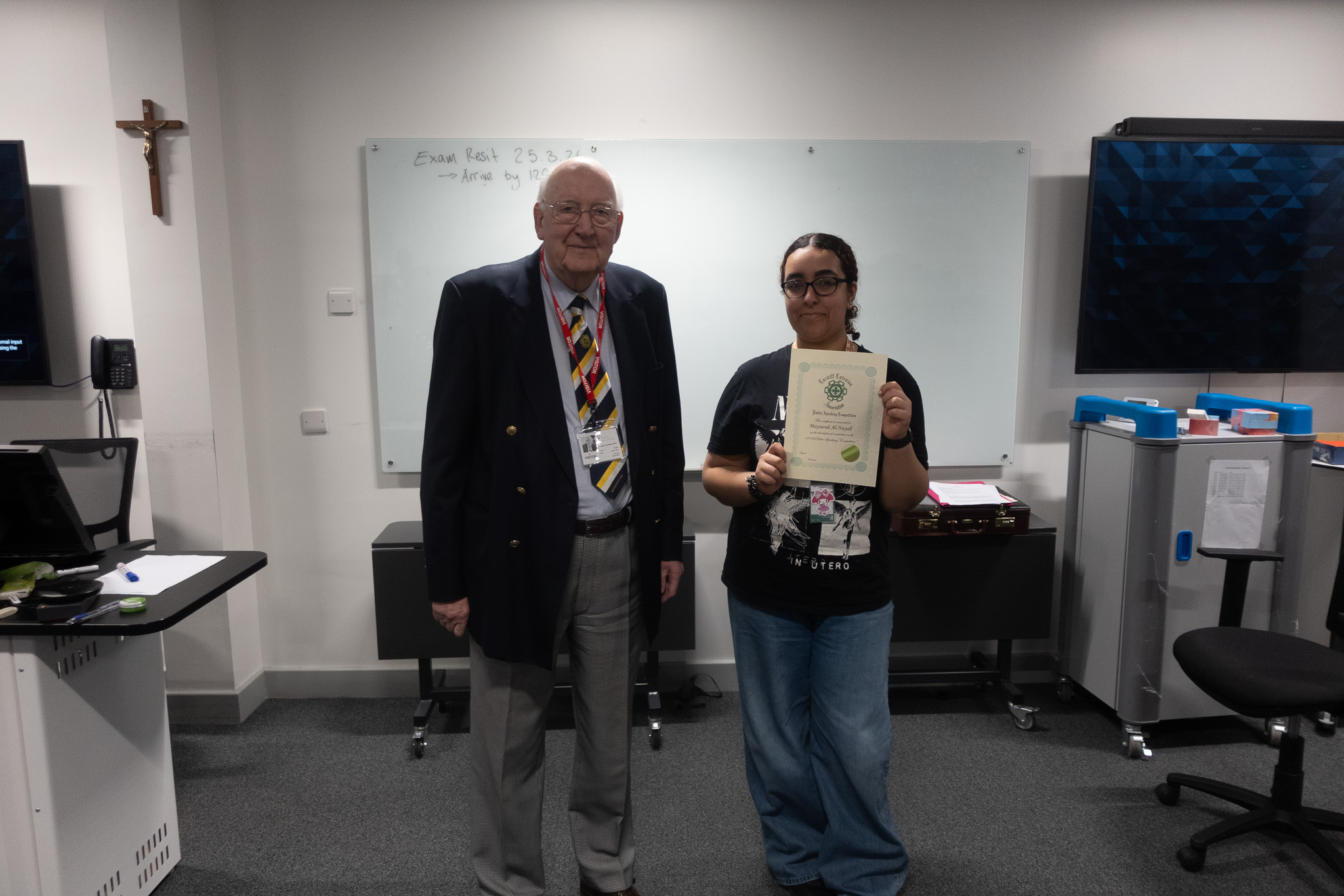 Student with his certificate