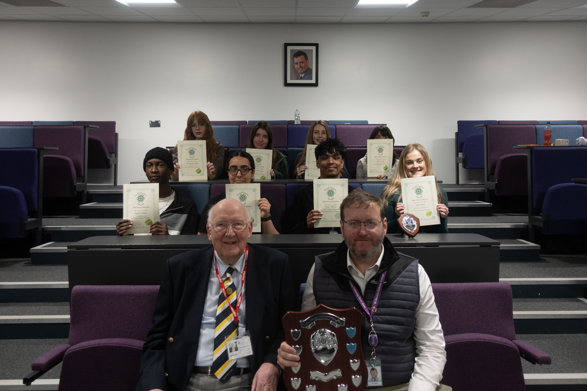 students with certificates from speech competition