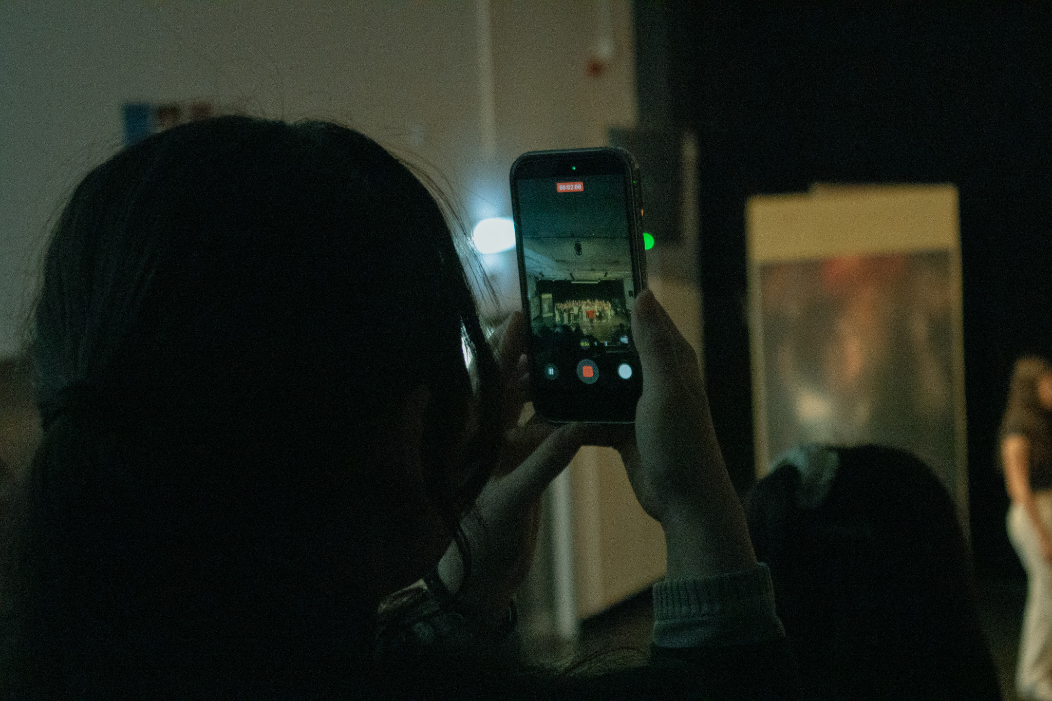 phone filming student performance