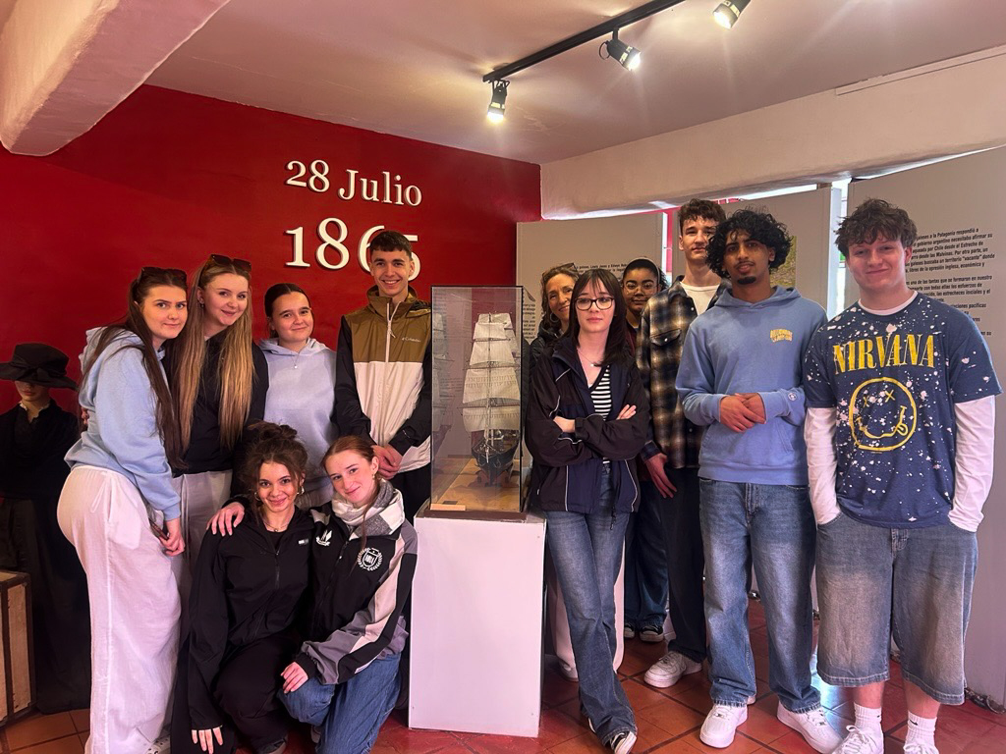 Students in front of a ship model in Argentina