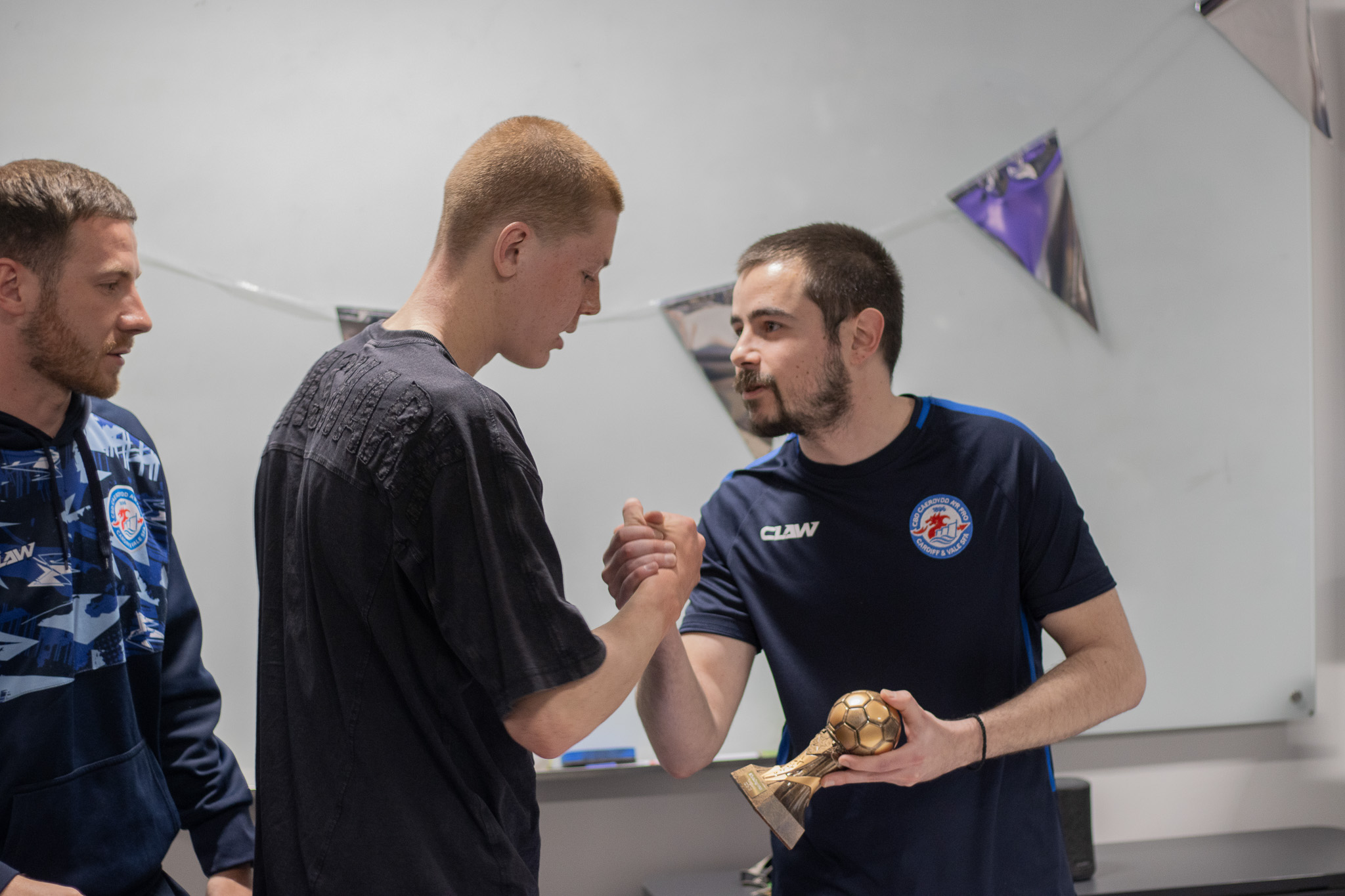 Football player with award at St David's Sports Awards
