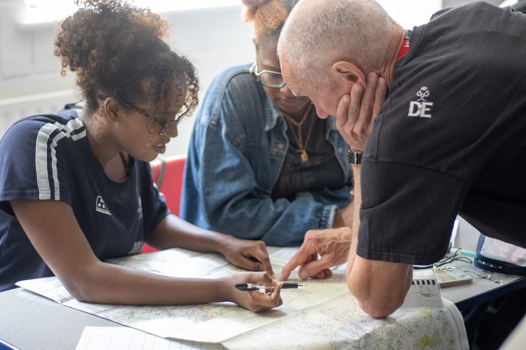 Student looking at a map with an instructor 