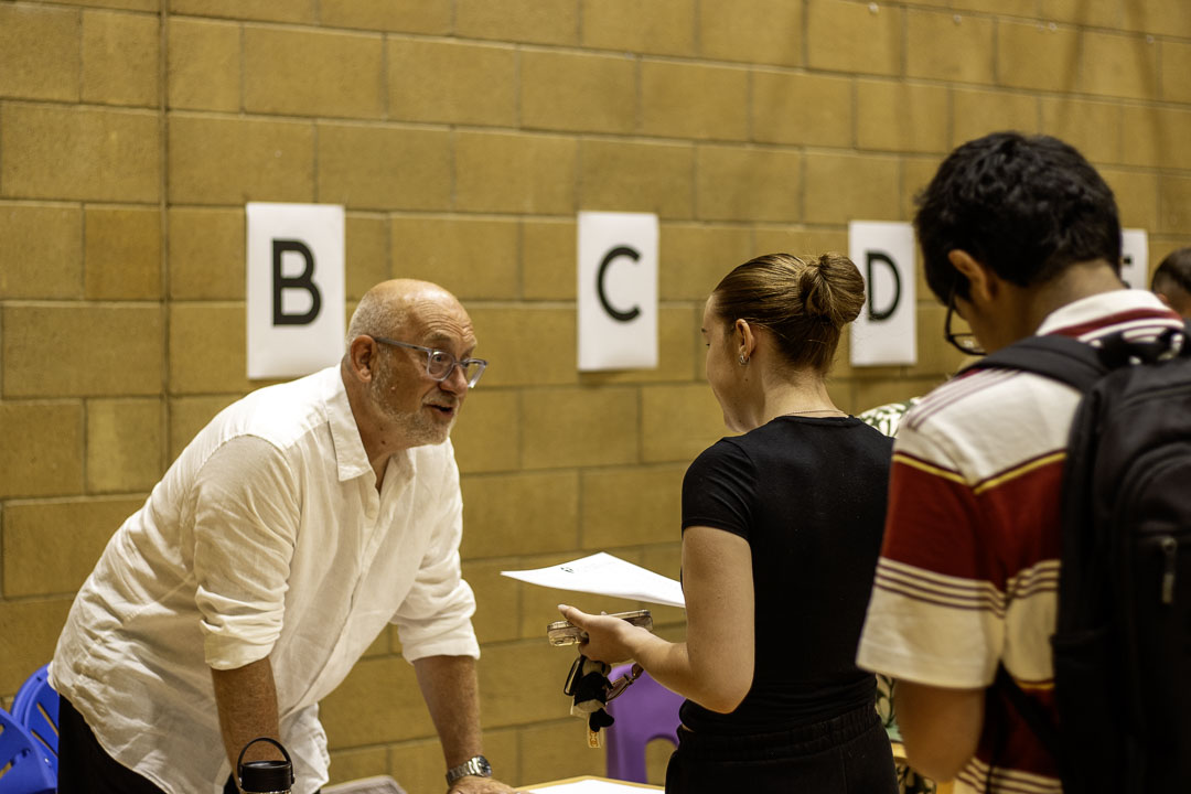 St David's staff member talking to student on results day 