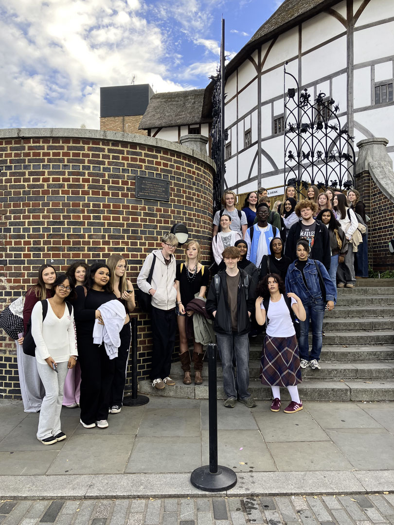 St David's College students standing on stairs outside of Shakespeare's Globe